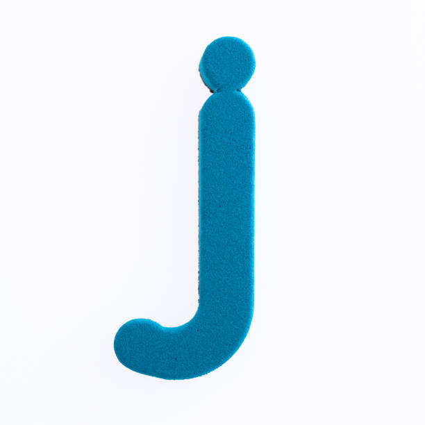 пенная буква j на белом фоне - letter j block toy alphabet стоковые фото и изображения