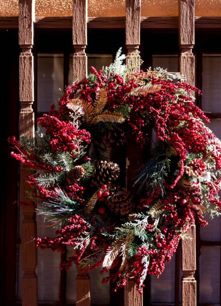 istock Red Christmas Wreath with Pinecones and Holly 1292670658