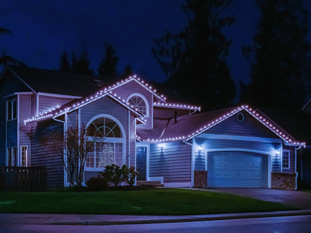 American suburban home exterior with festive Christmas lights stock photo