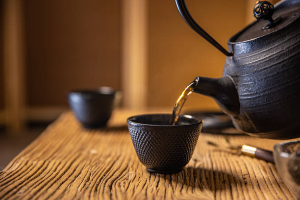 istock Asia traditional health drinking,Tea pouring into a tea cup 1292675821