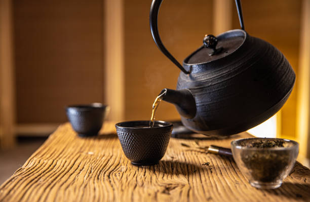 istock Asia traditional health drinking,Tea pouring into a tea cup 1292675832