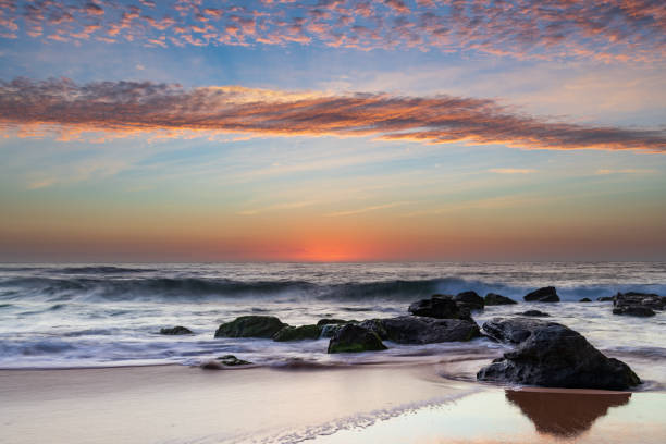 istock Beautiful sunrise with high cloud at the seaside 1292679262