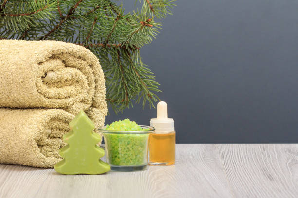 istock Spa composition with soft terry towel and spa products on wooden boards 1292682817