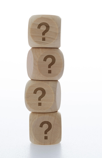 Wooden blocks with question mark.