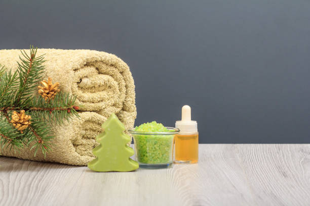 istock Spa composition with soft terry towel and spa products on wooden boards 1292683025