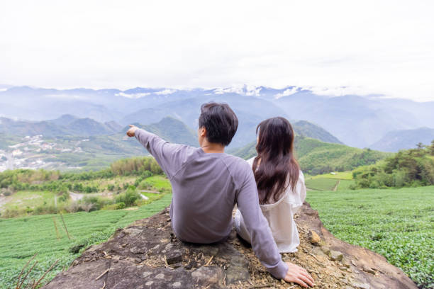 istock couple sit in tea plantation 1292683882