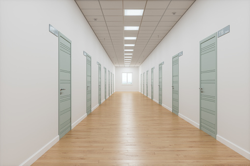 University Dormitory Hallway With Room Numbers On Green Doors.