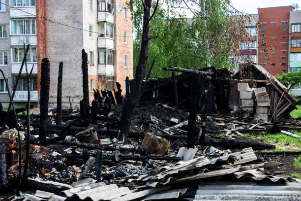 istock Logs from a burnt house, place after a fire 1292685574