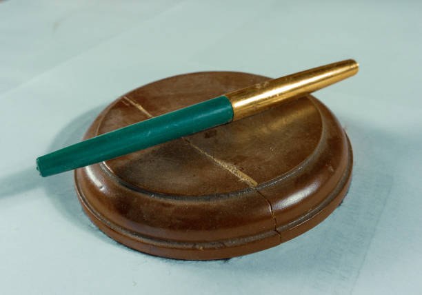 istock Pen on the judge's hammer holder 1292686509