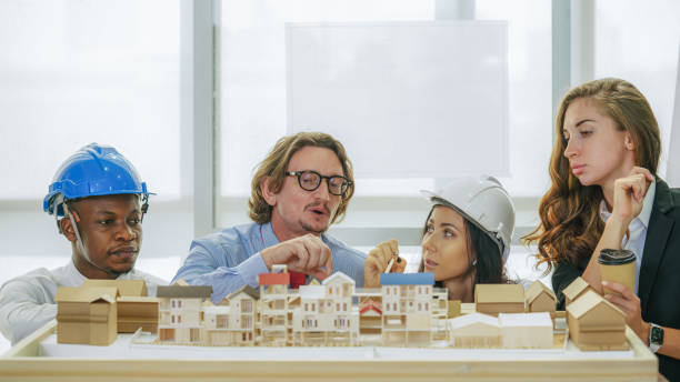 istock architecture business background of diverse project development architect team have brainstorming for residential project work with project architecture model on table in architecture office 1292686679