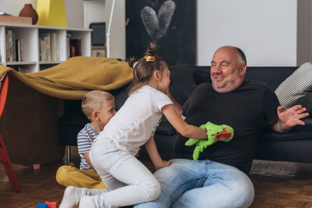 istock father play with his children at home 1292688303