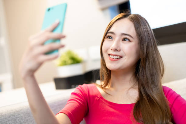 istock Asian woman takes selfie 1292688408