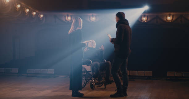 istock Actors rehearsing scene with handicapped director 1292689675