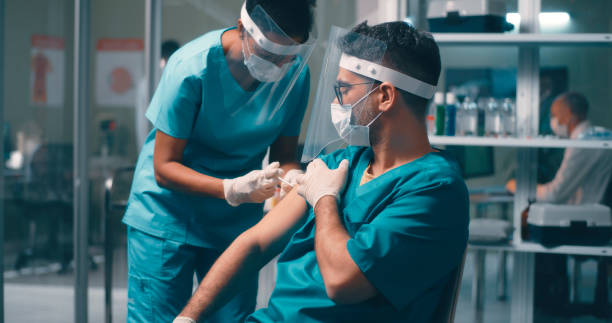 istock Medical practitioners during vaccination in hospital 1292690262