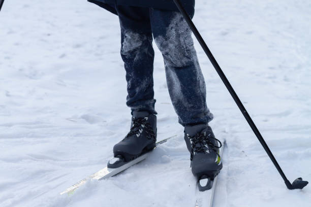 istock boy on skis in pants, stained with snow in winter 1292690493
