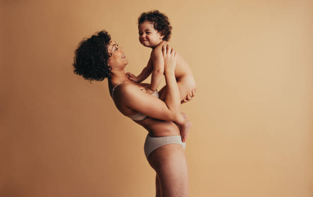 istock Woman holding her cute baby 1292692508
