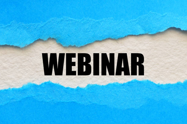 istock WEBINAR text written on a white piece of paper. 1292692562