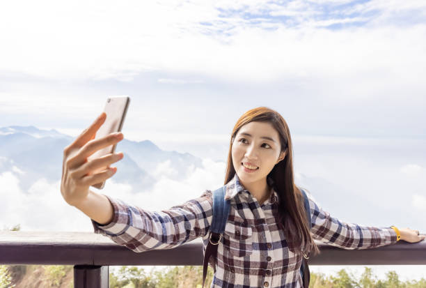 istock female traveler take selfie 1292692622