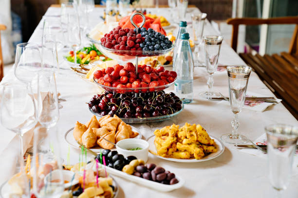 istock table served with light summer snacks-fruits, vegetables, berries. 1292694583