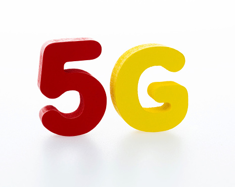 Wooden word 5G on white background.