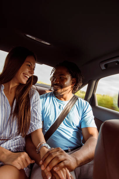 istock Romantic young couple falling in love while traveling in a car 1292696618
