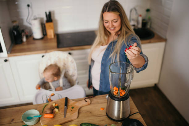 istock young mother is feeding her baby 1292700731