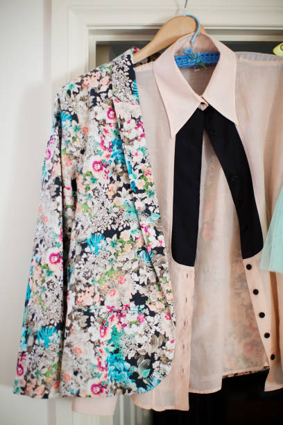 istock Womans wedding outfit hung up on a door frame 1292700812