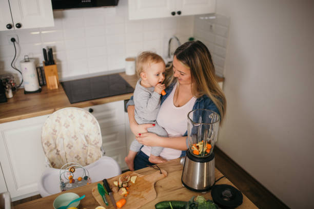 istock young mother is feeding her baby 1292700882