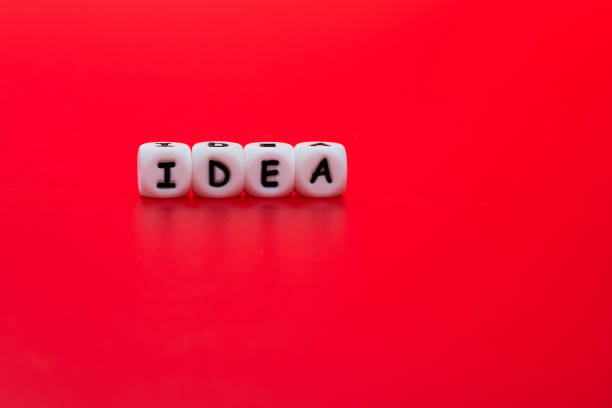 istock Dices with word idea on red background 1292702087