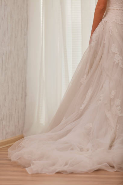 istock Rear view of unrecognizable bride in a wedding dress 1292702183