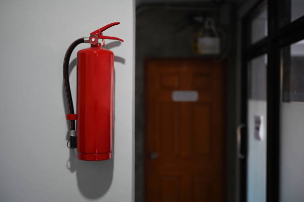 istock Red fire extinguishers tank for safety and fire prevention in a modern building. 1292702369