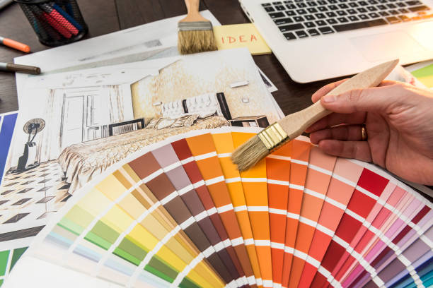 istock Male hand work with color sampler for design home 1292703353