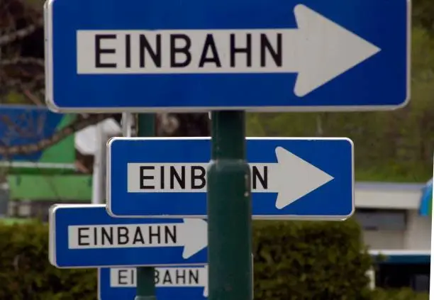 one way street (Einbahnstraße) traffic sign, blue with direction arrow