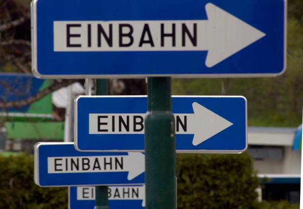 one way street (einbahnstraße) traffic sign - one way street sign imagens e fotografias de stock