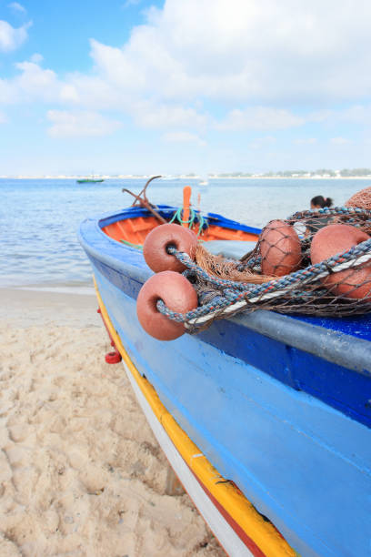istock Fishing boat on the beach 1292708094