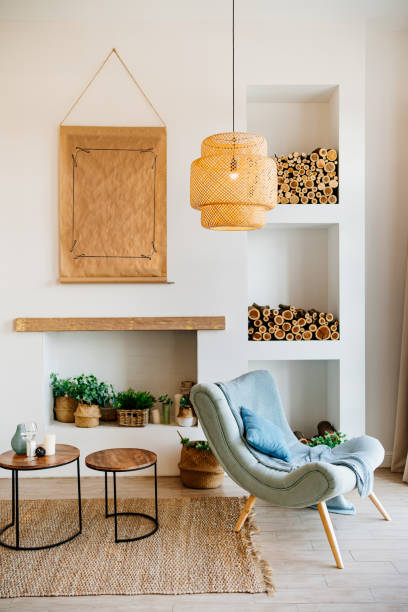 istock Scandinavian-style interior with a decorative fireplace and niches in the wall 1292711267