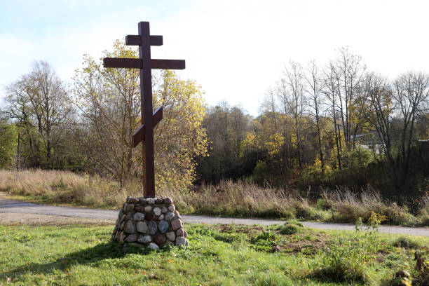 istock lonely grave with a cross in the countryside 1292712507