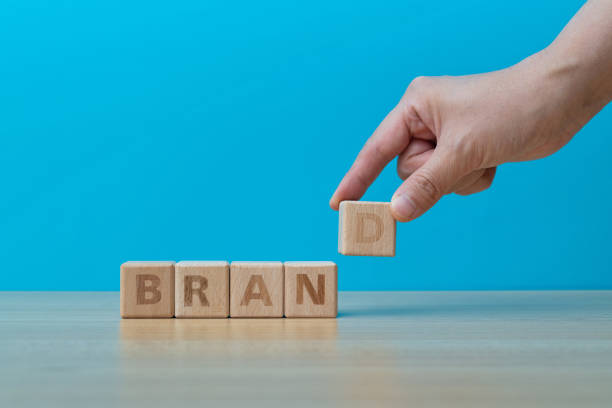 istock Human hand spelling word brand with toy blocks 1292713954