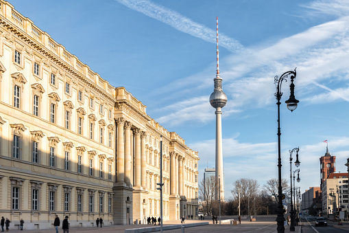 Berlin, Germany - December 20, 2020: view on new City Palace in the historic quarter in Berlin in front of tv-tower under blue december sky