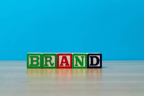istock Wooden blocks with word brand on the table 1292714151
