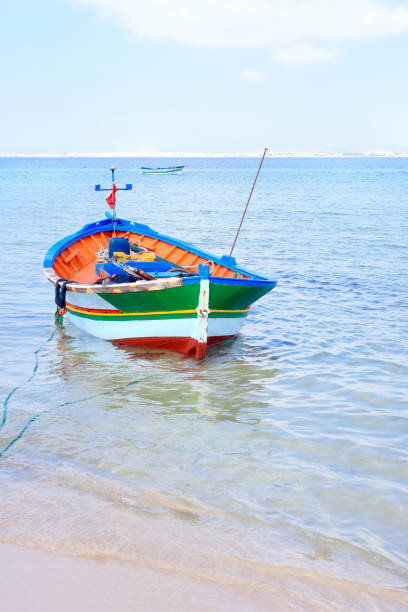 Fishing boat moored on the beach in the Tunisian seaside resort of Hammamet.
