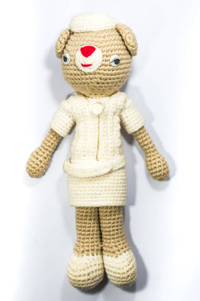 istock A cute nurse doll isolated on white background. 1292715055