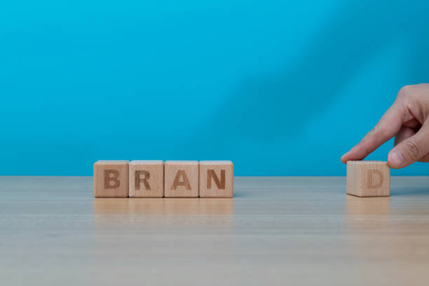 istock Human hand spelling word brand with toy blocks 1292715074