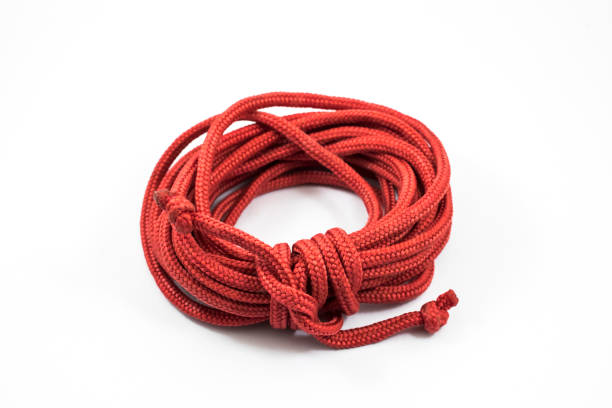 istock Red rope roll up isolated on white background. 1292715133