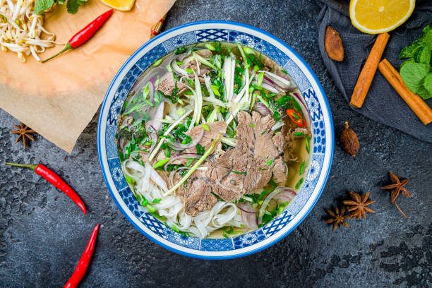istock Soup Pho Bo on black stone table, vietnamese cuisine 1292715220