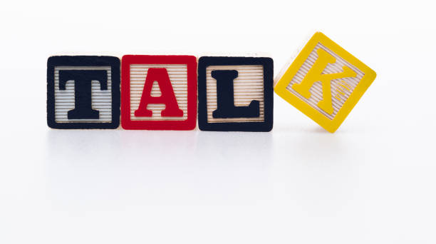 istock Wooden cubes with word talk on white background 1292718198