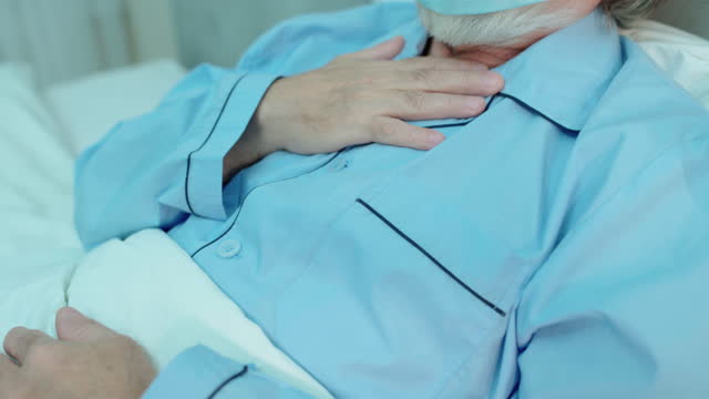 Sick elderly man feeling shortness of breath, chronic bronchitis, pneumonia