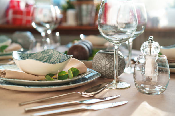 istock Beautiful elegant table setting with green stylish dishware and silver cutlery 1292722320