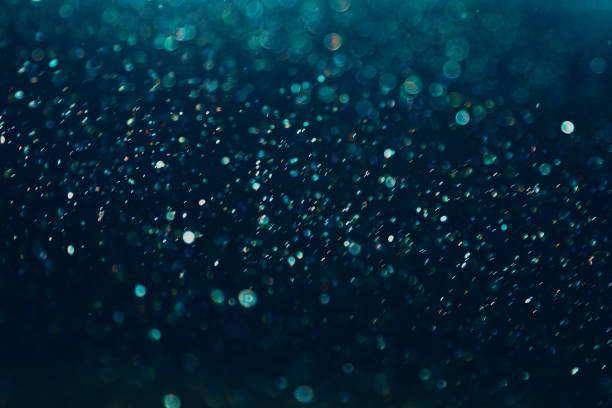 istock Festive glitter black and green light background 1292722541