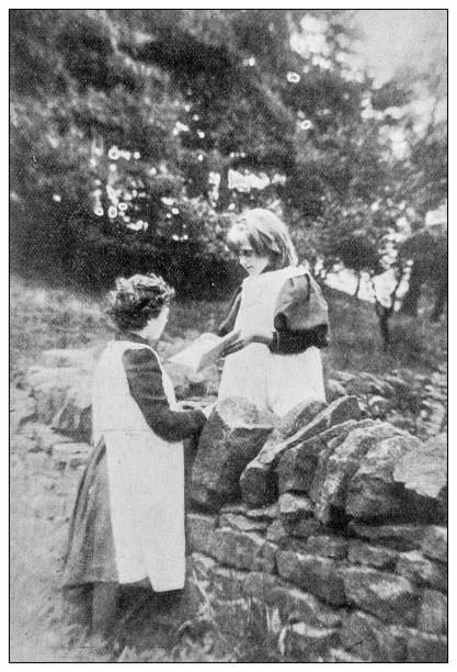 istock Antique dotprinted black and white photograph: Children outdoors 1292722585